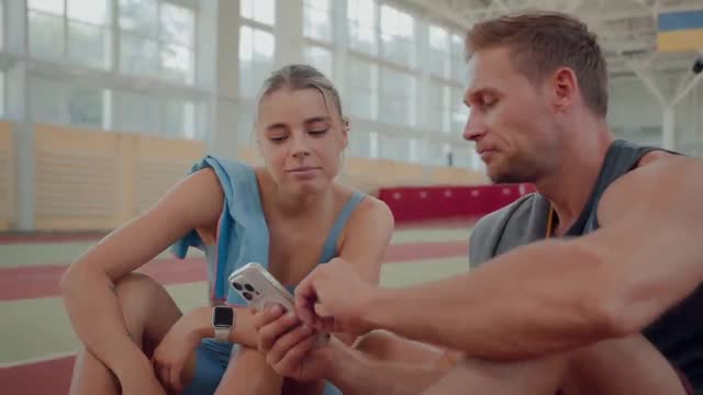 Athlete scrolling a camera roll full of workout videos